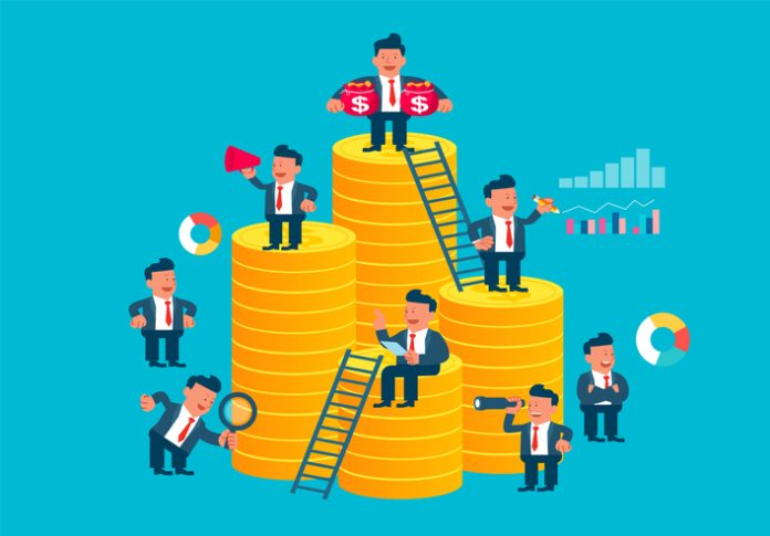 Business group team working together on stack of gold coins, financial investment management, teamwork and team management crowdfunding strategies