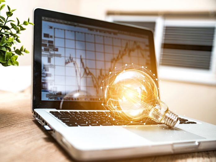 Closeup light bulb on keyboard laptop, New ideas, innovation, inspiration and creativity concept. Closeup light bulb on keyboard