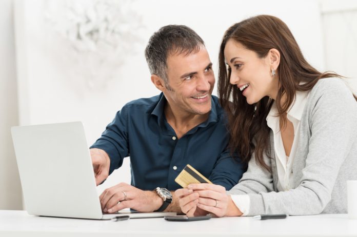 Online shopping together on a laptop cash advance