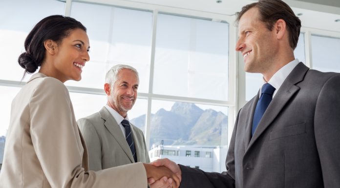 Smiling business people shaking