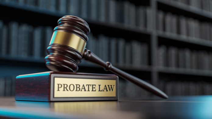 Probate Law: Judge's Gavel as a symbol of legal system and wooden stand with text word on the background of books probate process