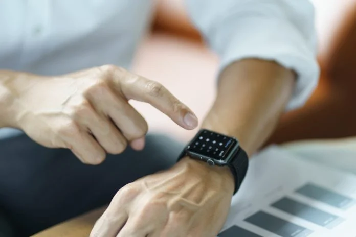 Business man Looking at smart watch In Office online connect Gadget technology Apple Watch