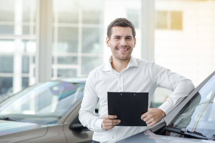 Young Man in a Car Rental Service Transportation Concept automotive customer service