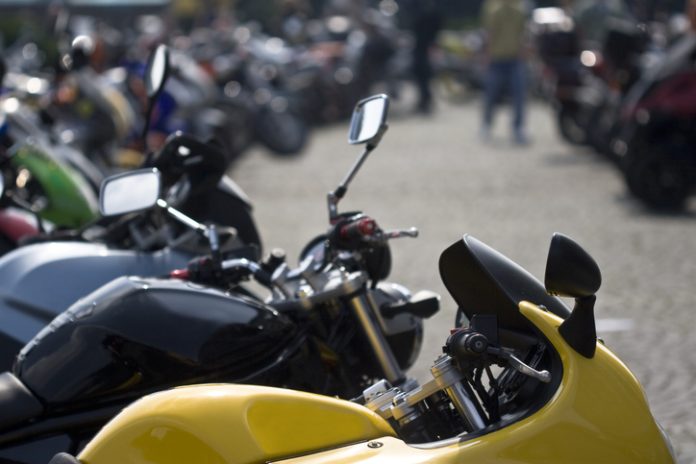 motorcycle line up at a show pros and cons of motorcycle riding