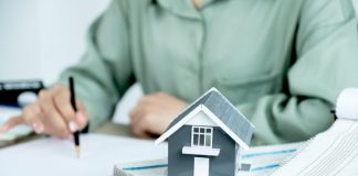 Property Investment: How to Invest for Success Home model standing in front of the property and interior agents are presenting houses and curtains for interior decoration.