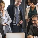 Xamarin Vs. React Native – Which Framework Should You Choose for Cross-Platform App Development Employees discussing app development framework