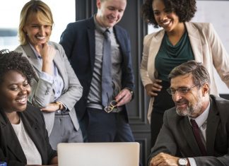 Xamarin Vs. React Native – Which Framework Should You Choose for Cross-Platform App Development Employees discussing app development framework