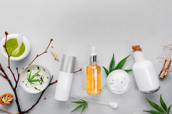 Cosmetics with cannabis CBD oil on light background. Concept natural skin care CBD Topicals and Creams