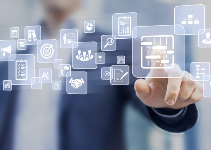 Manager touching AR screen interface, project management icons, scheduling, budgeting project management