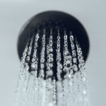 shower head with water drop flowing.