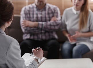 The Alternative to Litigation Close-up of therapist for couple analyzing behavior of spouses