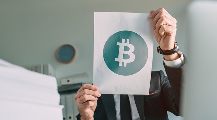 Learn Crypto with a Cryptocurrency Learning Platform businessman-holding-document-paper-with-bitcoin