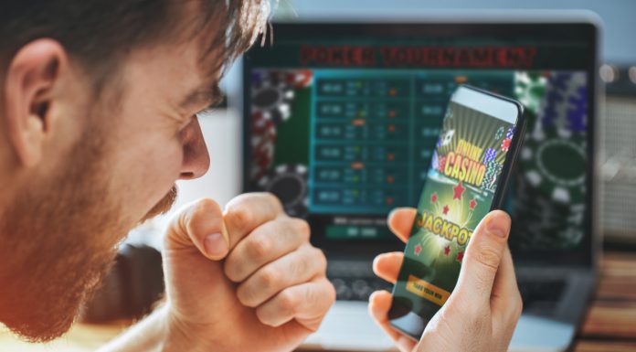Duelbits: Test Your Gambling Skills with this Unique Modern Dice! Man celebrating victory after making bets at bookmaker website