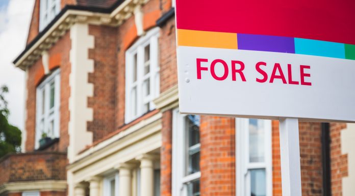 For Sale sign displayed outside a terraced house in Crouch End, London