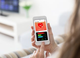 Female hands holding phone with app health tracking activity screen