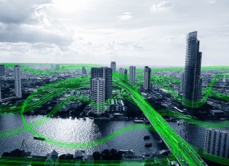 The Benefits Of Smart Buildings Black and white smart city with data communication flow network, communication technology concept