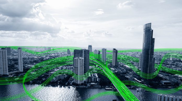 The Benefits Of Smart Buildings Black and white smart city with data communication flow network, communication technology concept