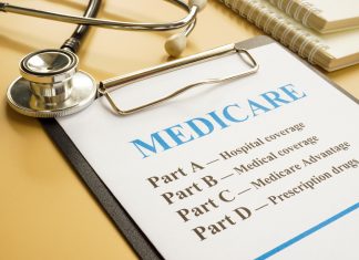 Medicare Supplement Vs. Medicare Advantage: Which One Is Better? Stethoscope with medicare form with parts list.