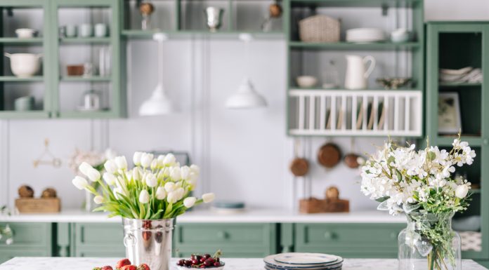 Keep Or Leave? The Toughest Items To Move Between Homes Kitchen countertop with flowers in bucket and jar