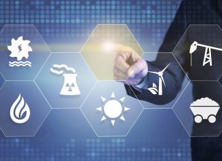 Projections for the Growth of the Global Portable Power Station Market Businessman touching the screen about energy source
