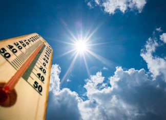 Thermometer Sun high Degres. Hot summer day. High Summer temperatures