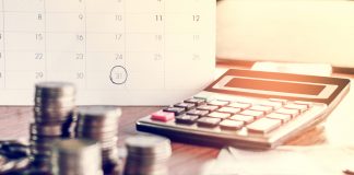 How Tax Relief Companies Can Help with Your Debt debt collection and tax season concept with deadline calendar remind note,coins,banks,calculator on table