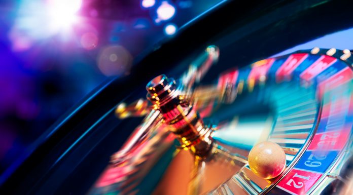 IGaming Trends We Expect To See In 2022 Roulette wheel in motion with a bright and colorful background