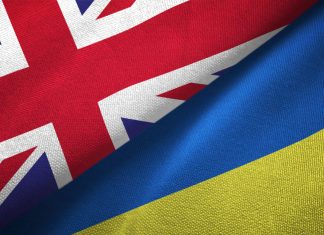 Ukraine and United Kingdom two flags together realations textile cloth fabric texture
