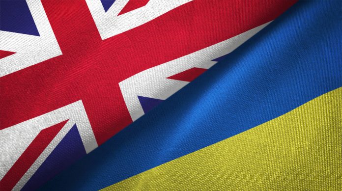 Ukraine and United Kingdom two flags together realations textile cloth fabric texture