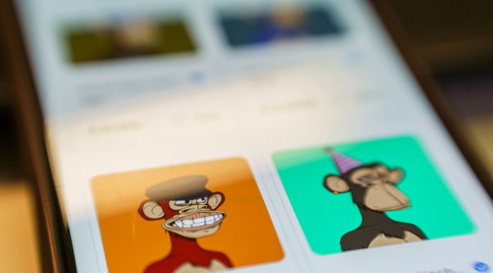The Bored Ape Yacht Club NFT (BAYC), a collection of 10,000 ape avatars that individually act as tickets to an online social club. Non fungible token on smartphone screen