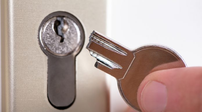 Man Holding Broken Key