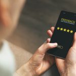 Top 10 LLC Formation Services According to Reviews customer feedback - woman using phone to give 5 star rating for good service