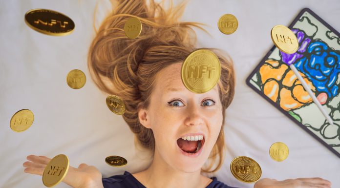 NFT Young woman, a digital artist, creates digital art on a tablet at home and shows a coin with the inscription NTF - non fungible token. Remote work, digital nomad, digital painting, animation, video