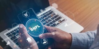 Businessmen holding a smartphone with icons of BNPL with online shopping icons technology. BNPL Buy now pay later online shopping concept.