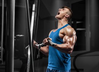5 Testosteron Tabletten Zur Testosteron Steigern In 2022 Muscular man working out in gym doing exercises at biceps, strong male