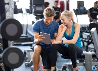 6 Reasons You Should Use Gym Management Software Personal Trainer with woman