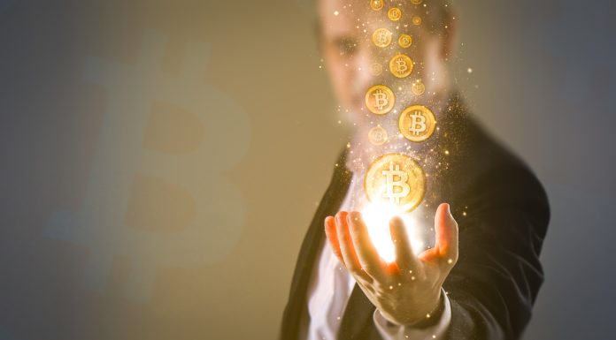 making money with bitcoin - Bitcoins coming from business man's hand