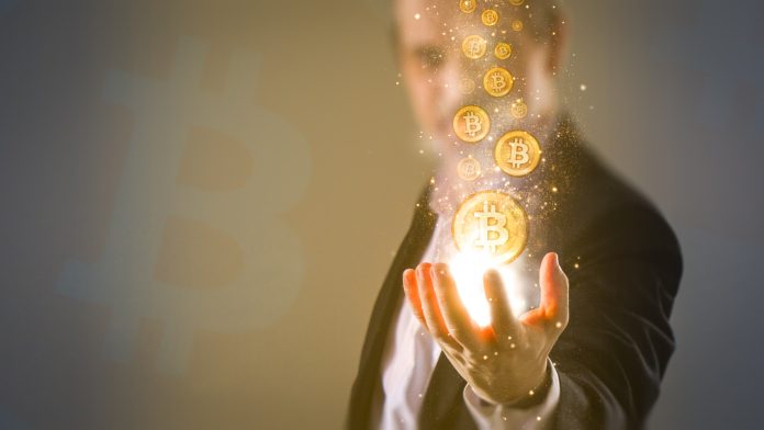 making money with bitcoin - Bitcoins coming from business man's hand