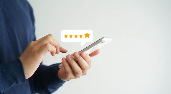 Did A Medieval Peasant Have a Need For an iPhone? close up on customer man hand pressing on smartphone screen with five star rating feedback icon and press level good rank for giving best score point to review the service , technology business concept