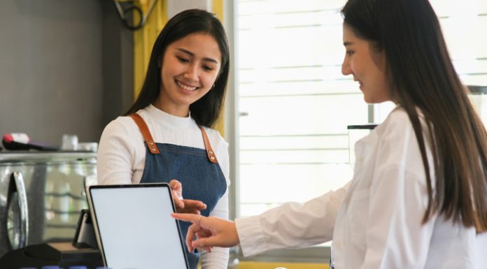 Top 10 Important Features Your Restaurant Billing Software Needs Customer self service order drink menu with tablet screen.