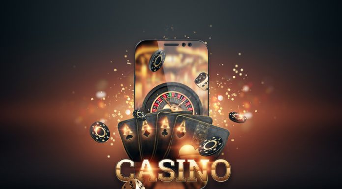 Smartphone with playing cards, chips and roulette, black-gold background. Concept of online gambling, online casino. Copy space. 3D illustration, 3D render.