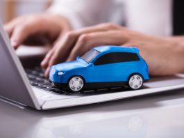Blue Car On Laptop Keypad