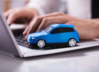 Blue Car On Laptop Keypad
