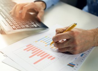 What is Data Modeling? office clerk working with statistical reports and entering data into a computer