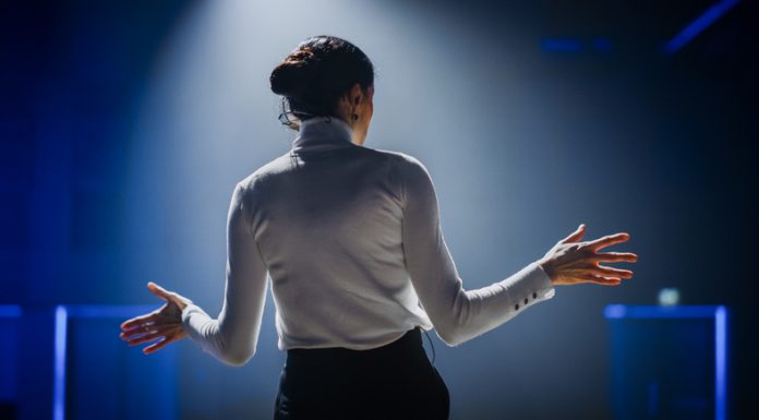 Five Ways to Stay Informed About Julia Black Business Insider Successful Female Motivational Speaker on Stage, Talking about Happiness, Diversity, Empowerment, Success, Leadership, STEM and How to Be Productive. Woman Presenter Leads Tech Business Conference