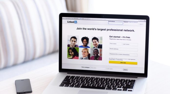 MacBook Pro Retina with LinkedIn home page on the screen