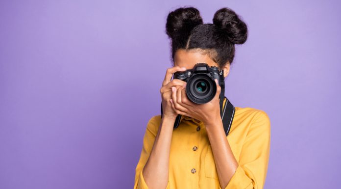 Digital Photography Services for Couples and Engagement Photos: What to Know When Hiring Photo of amazing dark skin lady holding photo digicam in hands photographing foreign sightseeing abroad wear yellow shirt trousers isolated purple color background