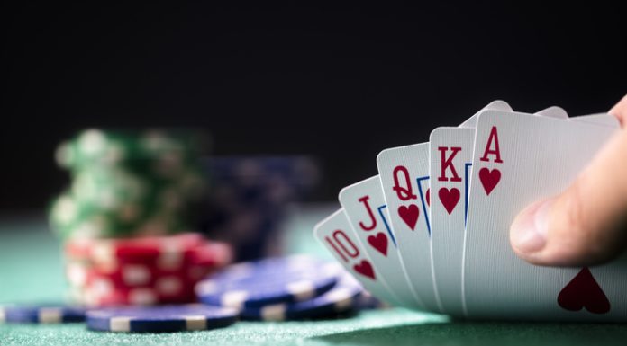 Five of the Biggest and Best Casinos in Europe Playing poker in a casino holding winning royal flush hand of cards