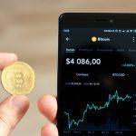 Crypto Trading: Best Money-Making Opportunity of our Time Hands holding a smartphone with bitcoin exchange rate