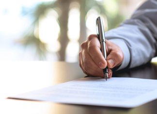 Top 5 Essay Writing Services in the UK Signing Official Document